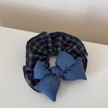 Close-up of blue denim and plaid padded bow hair scrunchie on a neutral background - Denim Dark Plaid Style