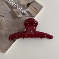 Detail einer burgunderroten Acetat-Haarklammer mit bunten Strasssteinen und Glanzfinish - Rot