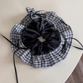 Detail of a large checkerboard and black satin scrunchie with elegant ribbon ties - Black Plaid Ruffle Scrunchie