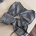 Close-up of black and white plaid decorative collar with elastic neck and black ribbon - Black Plaid Decorative Collar