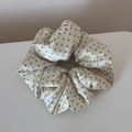Detailed close-up of cream satin scrunchie with mint green polka dots and silky texture - Large Polka Dot Green