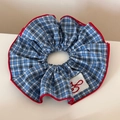 Detail of blue and white checkered scrunchie with red piping and delicate embroidery - Double Ring