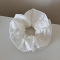 Detail shot of white striped mesh scrunchie with soft pleated texture for hair - White