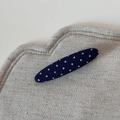 Detailed texture of navy blue polka dot fabric covering the oval snap hair clip - Navy Blue Polka Dot Long Oval Duck Clip
