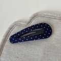 Detailed shot of dark blue polka dot fabric hair clip on soft linen background - Navy Blue Polka Dot Large Waterdrop BB Clip