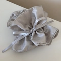 Elegant silver metallic drawstring gift pouch with a delicate silk ribbon bow detail - Scrunchie / Silver