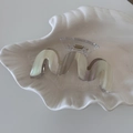 Close-up of a wavy iridescent hair claw clip with golden metal spring on a shell tray - Beige Grey M-Shape Style