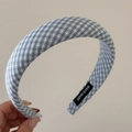 Detailed close-up of blue and white checkered scrunchie featuring a Hand Made textile label - Padded Headband / Light Blue Plaid