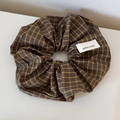 Detail of brown plaid scrunchie with blue-red lines and handmade woven label - Scrunchie / Brown Plaid