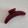 Macro shot of burgundy translucent acrylic hair claw clip with double row interlocking teeth - Crescent (12.5cm)