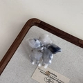 Macro detail of smoky gray marble acetate hair claw clip with petal design on wood box - Smoky Gray Minimalist Claw - Single Flower (6cm)
