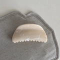 Close-up of cream marbled acetate hair claw clip with smooth curved design and strong teeth - Fan Shape Style