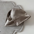 Detail of champagne satin hair claw with rose embossed texture on linen tray - Rose Embossed Triangular Claw Clip (FJ892473) / Brown
