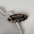 Close-up of leopard print fabric BB hair clip with oval design and black metal base - Leopard Oval BB Clip