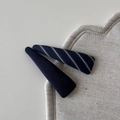 Detailed close-up of navy blue and striped fabric wrapped triangle hair clips on a linen mat - Striped Navy Narrow Triangle