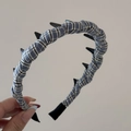 Detail of blue plaid fabric headband with black wavy teeth for secure hair styling - Blue White Black Plaid Long Tooth Hairband