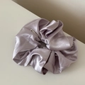 Close-up of a large lavender purple satin scrunchie with shimmering silver glitters - Shimmer Scrunchie / Purple