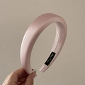 Detailed texture of pink satin headband with fine glitter and golden brand label - Starry Headband / Pink
