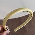 Detailed view of light yellow polka dot headband with silk-like satin fabric - Narrow Headband / Yellow