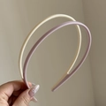 Close-up of flexible cream and lilac headbands with non-slip teeth for secure daily wear - Rice Pink