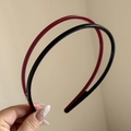 Dettaglio di cerchietti nero e rosso scuro con denti antiscivolo per una tenuta sicura - Nero Rosso
