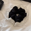 Detail of black and white polka dot pleated scrunchie with delicate ruffled edges - Black Polka Dot