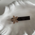 Detail of a brown duckbill hair clip with a translucent coffee-colored resin flower charm - Flower Clip Coffee