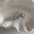 Detail of pearl bow hair clip with rhinestones and light blue silk ribbon in a shell tray - Light Blue Pearl Willow Leaf