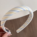 Detail view of handmade striped fabric headband with premium woven texture and label - Blue Yellow White Striped Headband