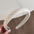 Detail showing cream striped fabric headband with premium thick padded design and non-slip edge - Beige Yellow Striped Headband