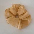 Detail view of yellow plaid chiffon scrunchie with lightweight and fluffy fabric texture - Fine Grid Chiffon Scrunchie Style / Yellow