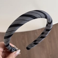Detailed close-up of striped fabric headband with premium texture and handmade label - Black Gray Plaid Headband