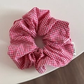 Detailed view of red and white gingham fabric texture on a large oversized scrunchie hair tie - Dopamine Fine Plaid Style (FQ88169) / Red
