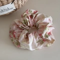 Detail of floral scrunchie featuring elegant pink pattern and soft ruffled fabric texture - Iridescent Floral Pink