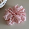 Detail of pink seersucker fabric scrunchie with silver rhinestones and textured finish - Pink