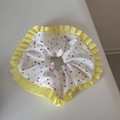 Detail view of polka dot scrunchie with colorful spots and yellow pleated ribbon edge - Multicolor Polka Dot Yellow Edge Scrunchie