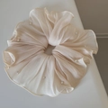 Close-up of pleated beige oversized hair scrunchie with delicate faux pearl accents - Beige