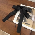 Elegant large black satin ribbon bow hair claw clip for women on a vintage book - Black Streamer Bow Small Claw