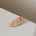 Detailed close-up of pink acetate hair clip with marble texture and water drop shape - Watermelon Pink