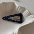Macro detail of navy blue polka dot canvas triangle hair clip on shell plate - Dark Denim Polka Dot-Triangle