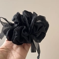 Detailed view of large black puff chiffon hair scrunchie with pleated organza texture - Black