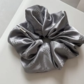 Detail of silver grey satin scrunchie with 3D embossed rose pattern and silk texture - Rose Embossed-Gray