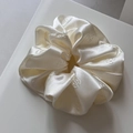 Detail of rose embossed satin scrunchie showing smooth silk texture in pearl white color - Rose Embossed-Off-white