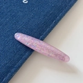 Close-up of a pink glitter hair clip with iridescent sparkles on blue denim fabric - Shell Sequin Side Clip-Pink