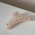 Vue détaillée de la pince à cheveux rose translucide ornée de strass colorés - Rose Champagne