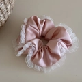Detailed close-up of soft pink satin scrunchie with layered white organza ruffle edges - Gentle Ruffled Satin-Pink
