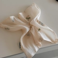 Close-up of beige floral fabric hair scrunchie with detailed pink embroidered flowers - Apricot Flower Bow Hair Tie