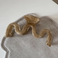 Detailed view of large apricot marble hair claw clip on soft textured fabric surface - Apricot Marble - M-Shape