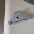 Close-up of blue and white striped hair claw clip with black bow prints for women - Blue White Striped Fan-shaped Style