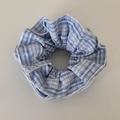 Close-up of blue plaid scrunchie with white lace trim and soft fabric texture - Blue Series - Lace Pattern